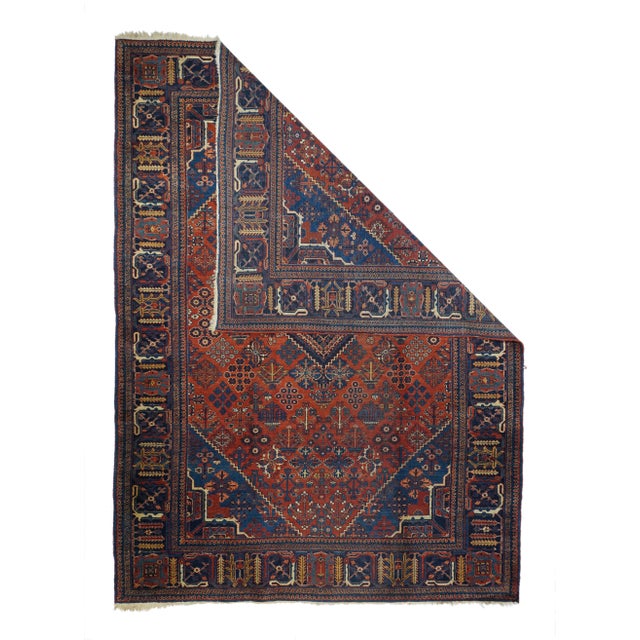 Vintage Persian Joshaghan Rug 7'3" x 10’3". Definitely in the iconic Joshagan manner with a red field displaying flower,...
