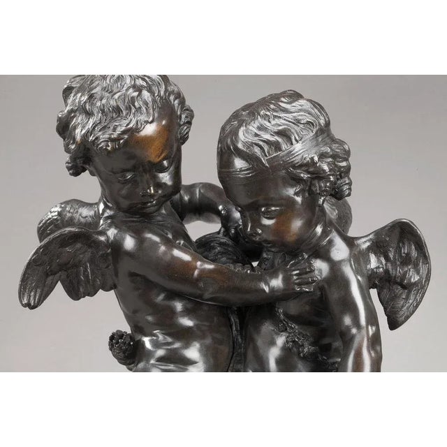 Bronze group with brown patina featuring cupids fighting over a heart after etienne-maurice falconet (1716-1791). This...