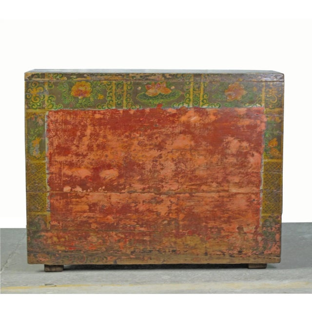 This rustic red/green antique cabinet is adorned with delightful patina and rich colorful texture that can only be created...