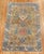 A fine example of camel field Caucasian Rug. Shades of denim blue and orange sprinkled in 3'4" x 5'3"