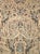 This early 20th-century Persian Mahal carpet presents a richly detailed allover floral composition across a warm ivory and...