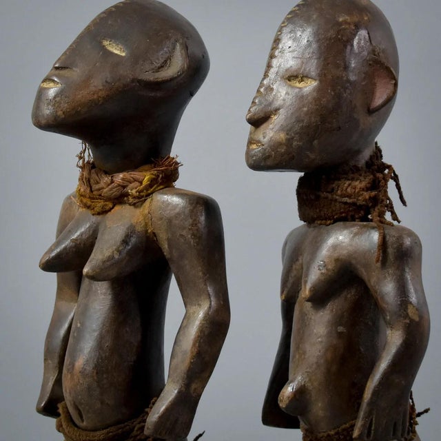 Add a touch of West African heritage to your collection with this exquisite pair of Ngbaka Miniature Figures.Â These...
