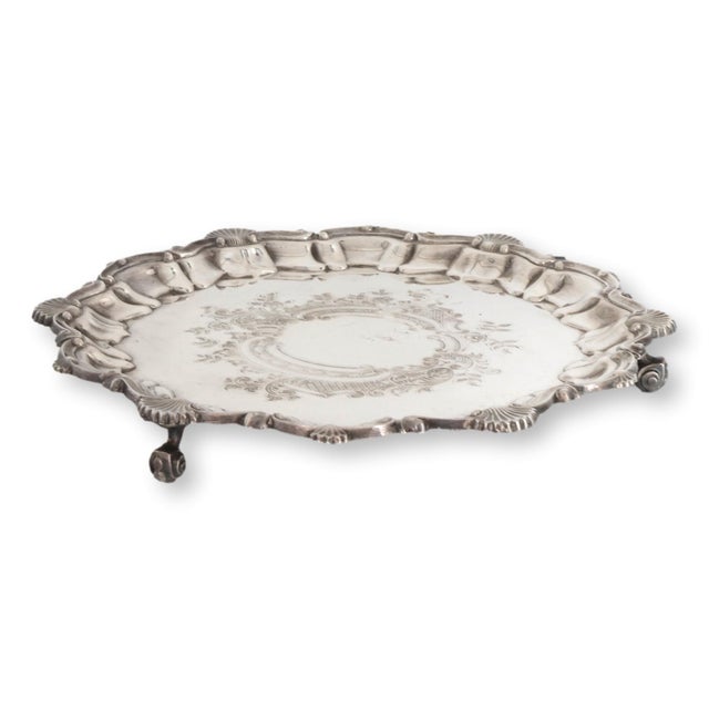 Early 20th century English silverplate drinks tray with richly hand chased decoration, scalloped edge, and substantial...