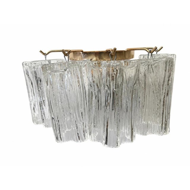 Elegant set of six vintage Italian wall sconces, featuring a refined gold-plated metal frame and thick clear glass...