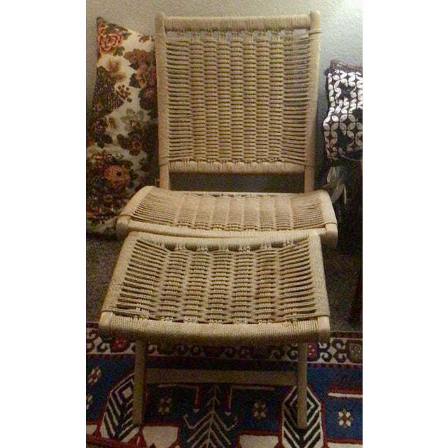 Great pair of vintage rope lounge chairs and ottoman as in the style of Hans Wegner. The ottoman is 15x20 inches. With a...