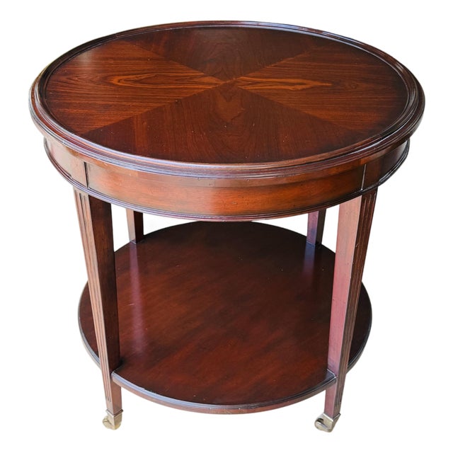 Vintage Mahogany Two-Tier Side Table | Bookmatched Starburst Top | Fluted Legs | Brass Caster Feet For Sale