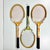 This is a set of three Vintage Wilson Wood Tennis Rackets from the 1970-1980s. Two are yellow and red paint with the third...