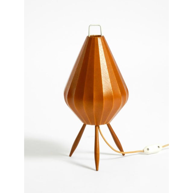 Very rare Mid-Century Modern tripod table lamp with an original brown-red cocoon shade. Great minimalist 1950s design....