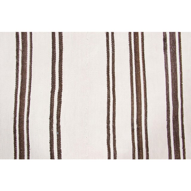 Handwoven from hemp and originating from Turkey circa 1950-1959, this 5x7 vintage kilim joins Rug & Kilim’s Kilim & Flat...