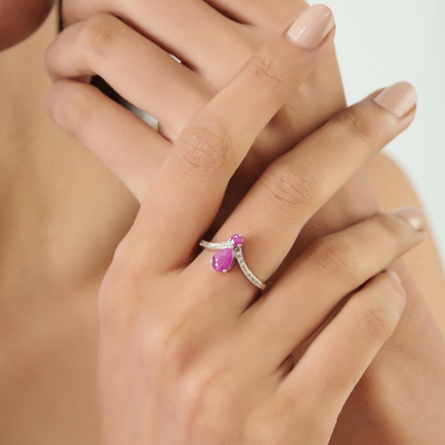 The 1.03 Ct Ruby & Diamond Cocktail Ring brings together a pear-shaped ruby and round gemstone detailing for a...