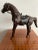 This impressively realistic vintage horse is made of wood, and features leather accessories. Careful attention has been...