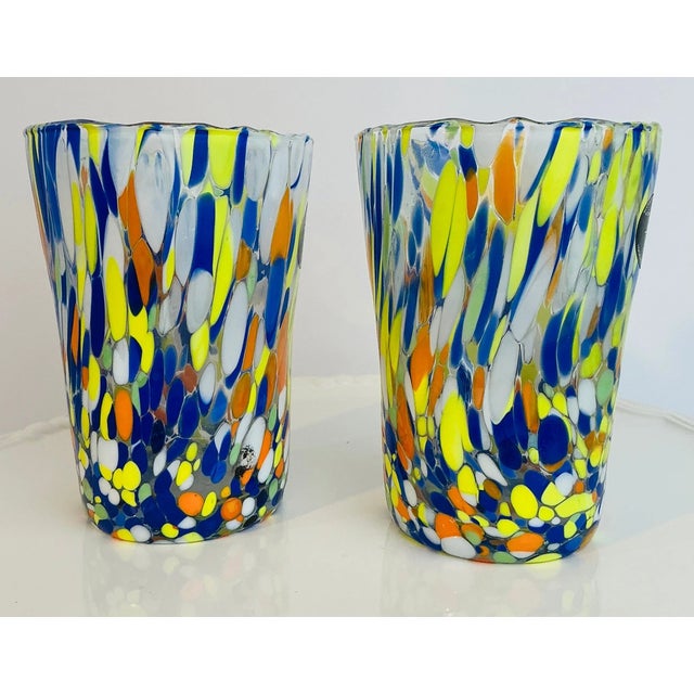 Add vibrant Italian-inspired elegance to your table with this beautiful set of two Hand-Blown Murano Style Art Glass...