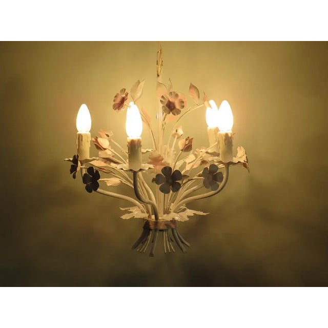 Vintage Toleware chandelier with floral motifs, Italy 1960s. The chandelier has 5 light points (E 14) in the shape of...