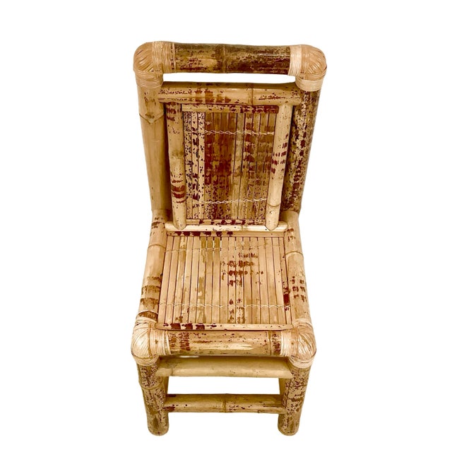 A wonderfully textural vintage bamboo side chair with a tall, graphic silhouette and naturally varied surface. Substantial...
