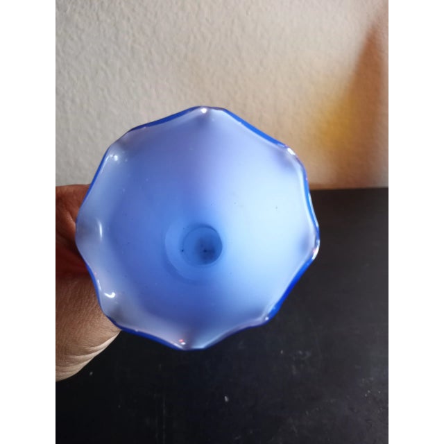 This is a Cobalt Blue Ombre Hand Blown Cased Glass 8" Bud Vase. Procured at auction