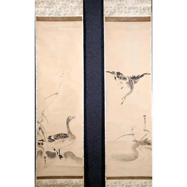 A fine matching pair of hanging scrolls ink on paper mounted in green brocade borders circa Edo period (17-18th century)....