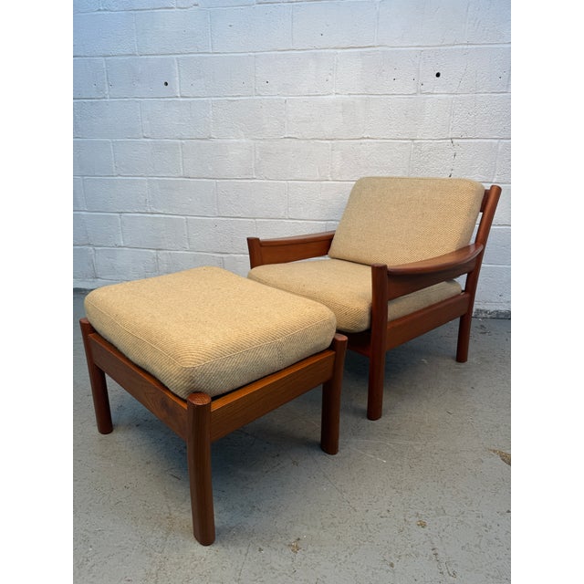 Elegant mid-century modern lounge chair and matching ottoman by Dyrlund, showcasing exceptional Danish craftsmanship and...