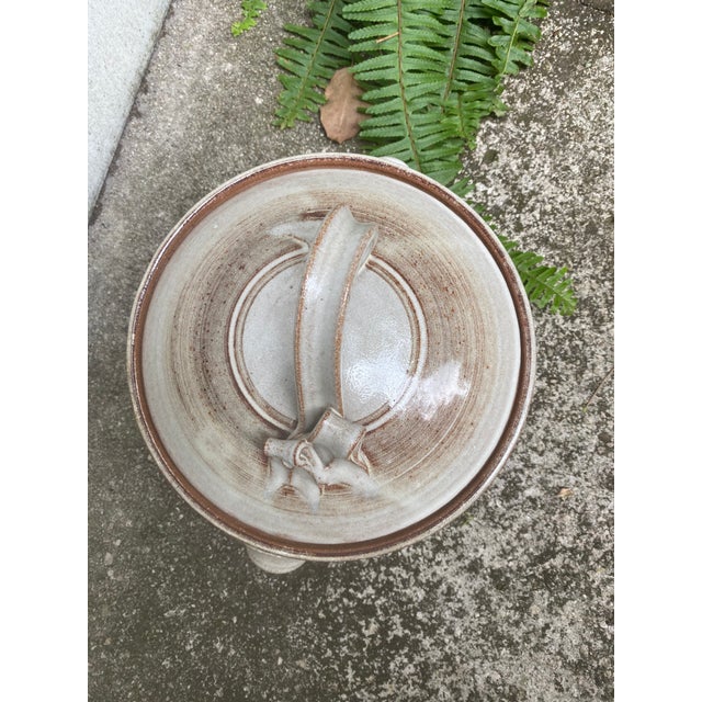 Lovely handmade soup tureen with lid. Interesting handle detail and color. Glazed ceramic.