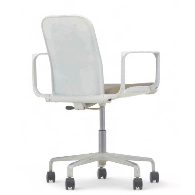 Fred scott. Office chair, model supporto, on five-step legs with frame and armrests in white lacquered aluminium, seat,...