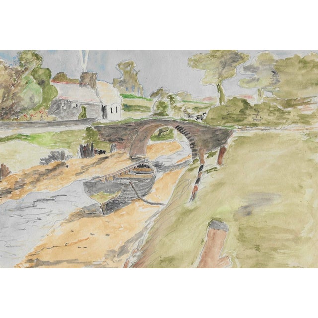 1943 painting on paper of a village, bridge and stream by Devon artist William E. Wood. Signed and dated, combined...