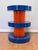 A graphic, high-impact side table in cobalt blue and orange lacquered MDF in the style of Swedish home brand Jotex — part...