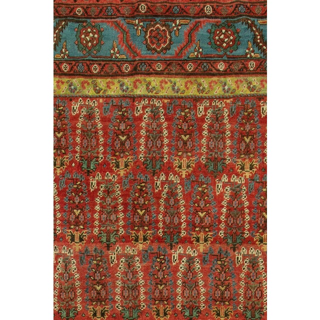 Stunning Persian corridor size Bakshaish rug featuring an all-over Paisley motif design in rich colors. In their softness...