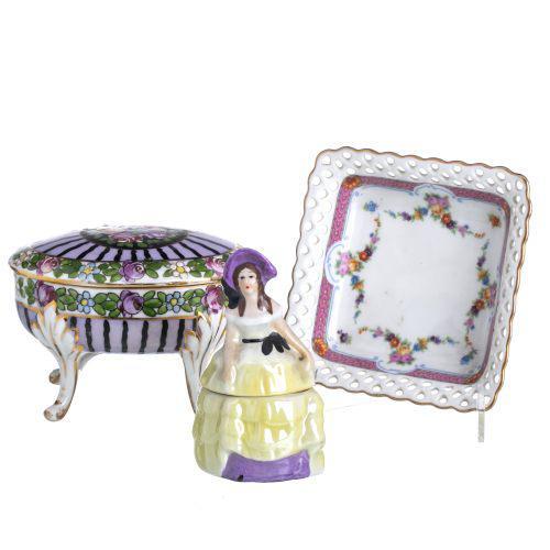 In European porcelain, from the 19th century, one of the boxes in Austrian porcelain and a saucer marked Schumann....