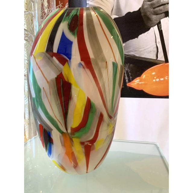 Impressive Vase in Milky-White Murano Glass With Multicolored Reeds.The colored glass rods are melted into the milky white...
