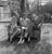 American Family Portrait of a middle class family sitting on a rattan bench in their garden, US, circa 1945. (Photo by...