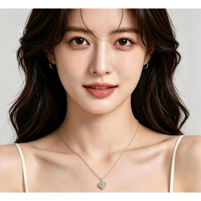 Elegant 14K white gold pendant necklace featuring a heart design set with natural brown, champagne, and white diamonds...