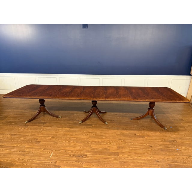 This is a Large Traditional Multi-Banded Mahogany Dining/Banquet Table by Leighton Hall. It features a field of swirly...