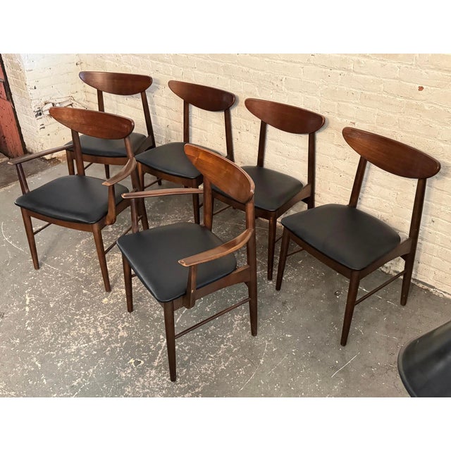 Set of 6 Mid-Century American walnut dining chairs by Stanley furniture. Set includes two armchairs, solid wood...