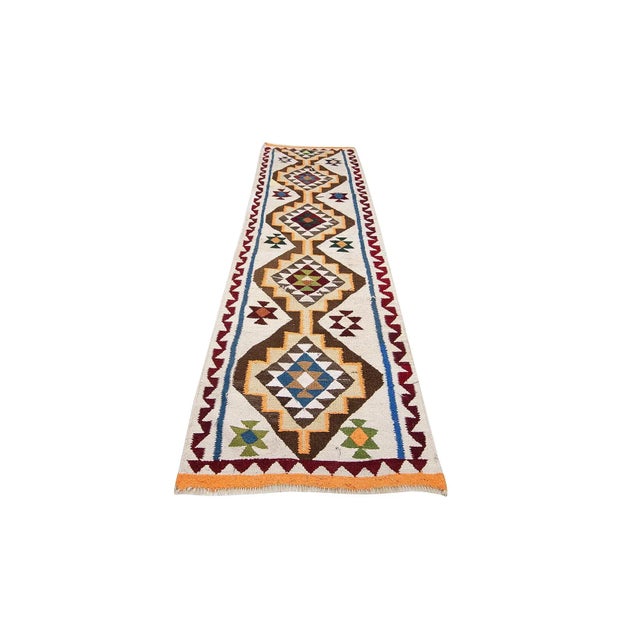 Vintage handwoven decorative kilim runner from Northern Iraq. Approximately 40-50 years old. In very good condition.