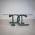 Coffee table with a kidney-shaped clear glass top. The legs are formed as intertwined, naturalistically rendered snakes...