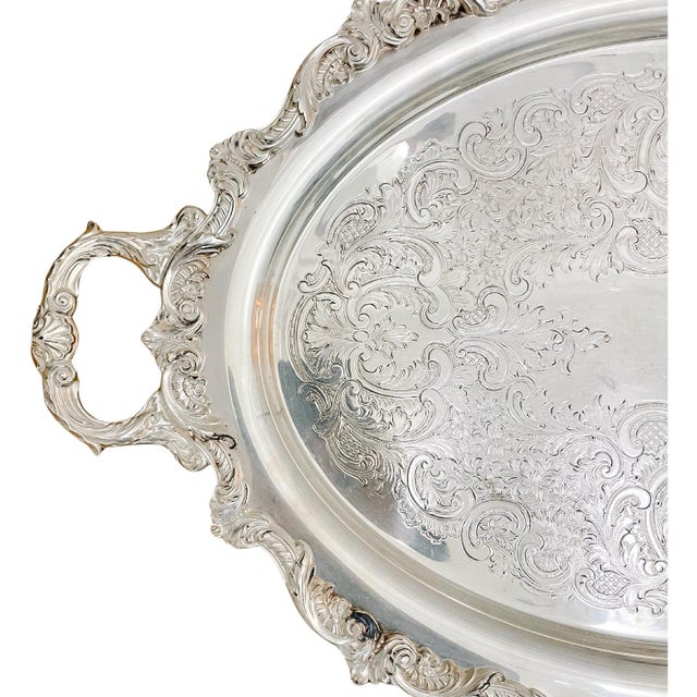 A fantastic large American made silverplate waiter tray by Poole Silver Co with a beautiful ornate design. It is a rather...
