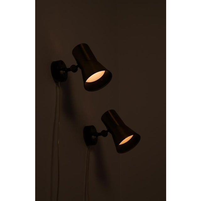 Brass wall lamps designed and produced by Hans-Agne Jakobsson, Markaryd, Sweden, 1960s. This piece is attributed to the...