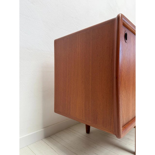 Elegant danish mid-century sideboard manufactured by h.p. Hansen in the 1960s. crafted in teak, the sideboard features two...
