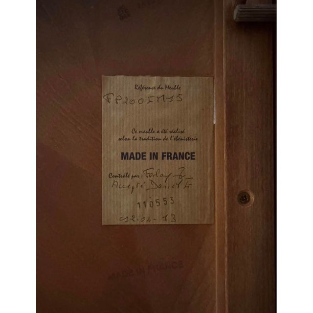 This label indicates that the piece is a modern reproduction of classic French furniture, likely manufactured around April...
