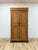 This vintage armoire brings a genuinely versatile piece of coastal boho furniture to any room, combining faux bamboo...