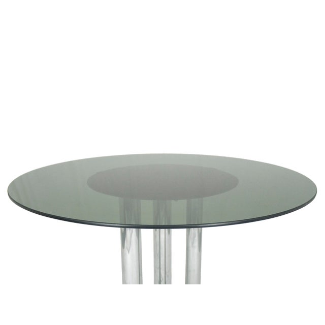 This table was produced in Italy by Poltronova in 1969. It is made from a chrome plated base with a shaped thick feet and...