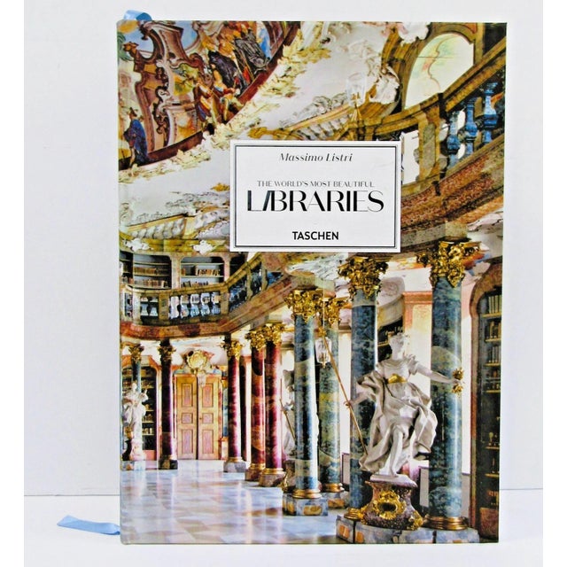A large hardcover book titled "The World's Most Beautiful Libraries" by Massimo Listri, published by Taschen in 2021. The...