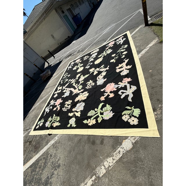 Design Plus Gallery presents an 11ft 8in × 13ft 11in Romanian Kilim Area Rug from Starck. This oversized rug has a black...