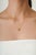 This elegant station necklace features a 2.04 carat natural lemon topaz set in 14K yellow gold. The lemon topaz measuring...