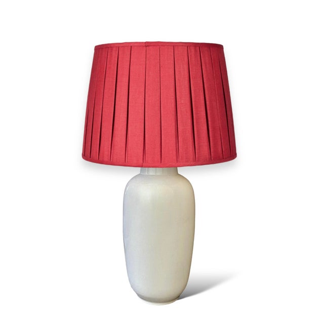 A fantastic large-scale mid-century table lamp in soft cream with a crackle glaze, adding richness and dimension. The...