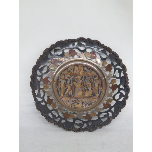 This gorgeous decorative metal plate features an intricate Egyptian etching at its center, showcasing beautiful...