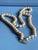 Vintage Mid Century Japanese single strand necklace featuring lustrous faux pearls individually knotted along the strand...