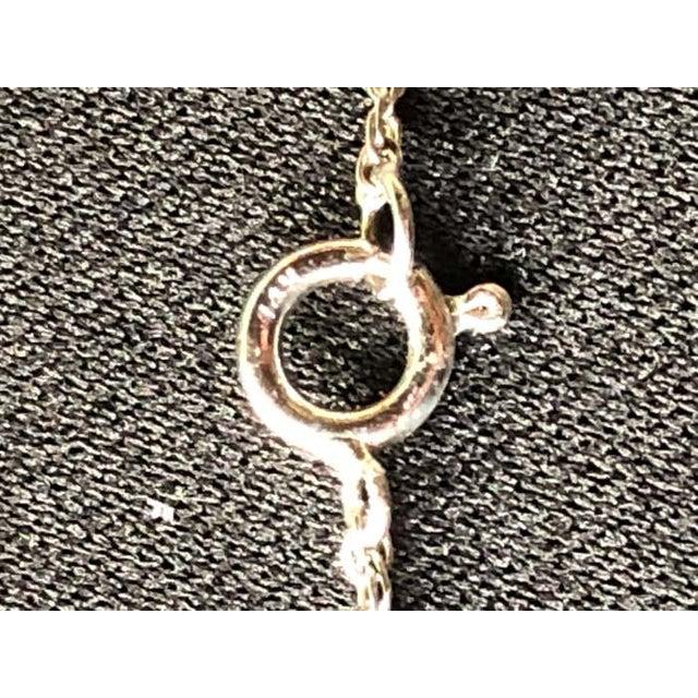 14 Karat White Gold 20 Inch Fancy Necklace with Diamonds. 5 pc round diamonds 4.8 grams total weight. 14K stamped