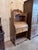 A charming early 20th century oak cylinder roll secretary desk showcasing warm oak grain, graceful curves, and decorative...
