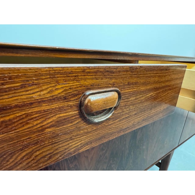 Exceptional Dutch sideboard designed and produced by Fristho in the early 1960s. Crafted in wood veneer and preserved in a...