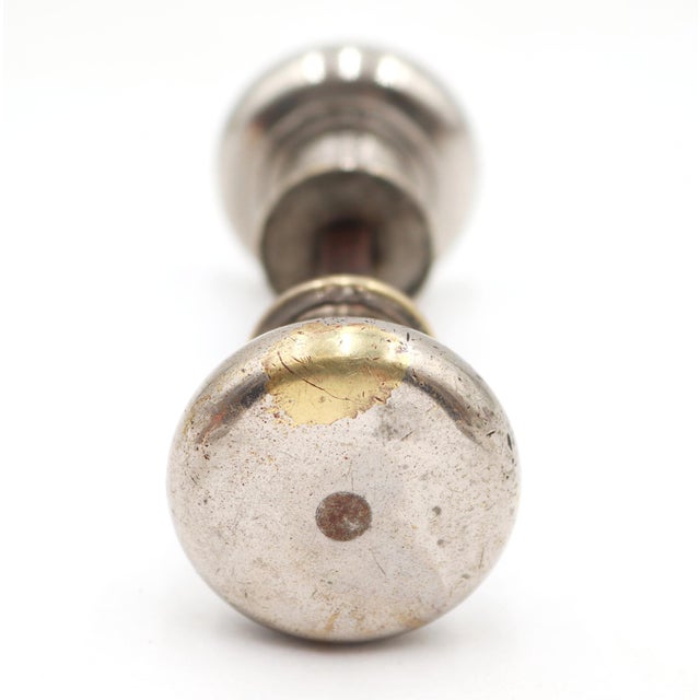 Vintage nickel plated brass petite door knobs with a wide shank. Priced as a pair of knobs with a spindle. Good condition...